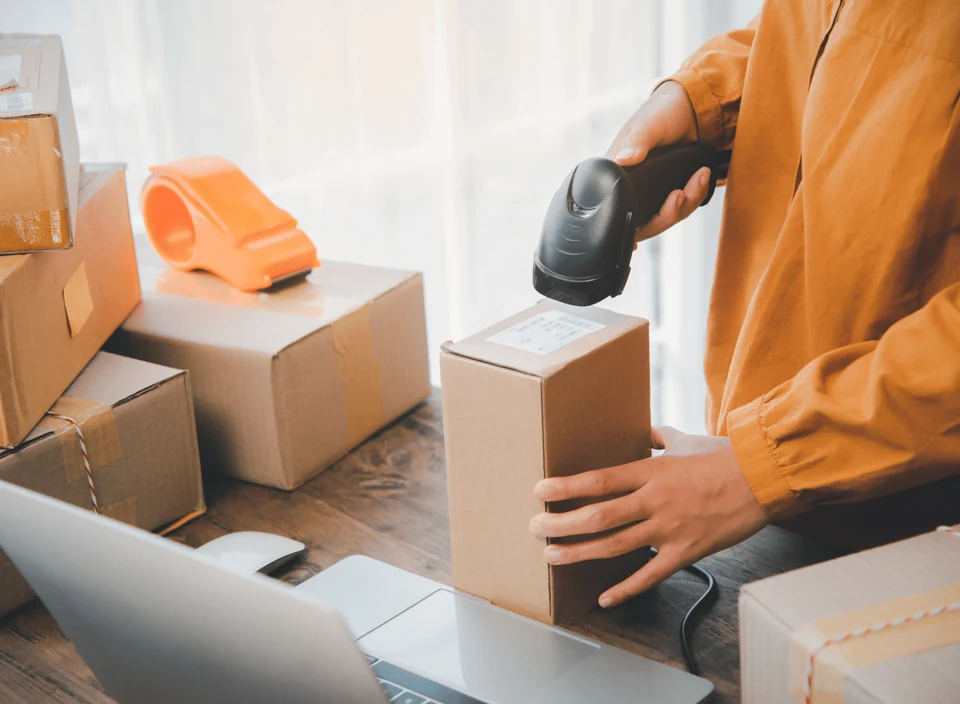 Warehouse worker scanning a parcel barcode